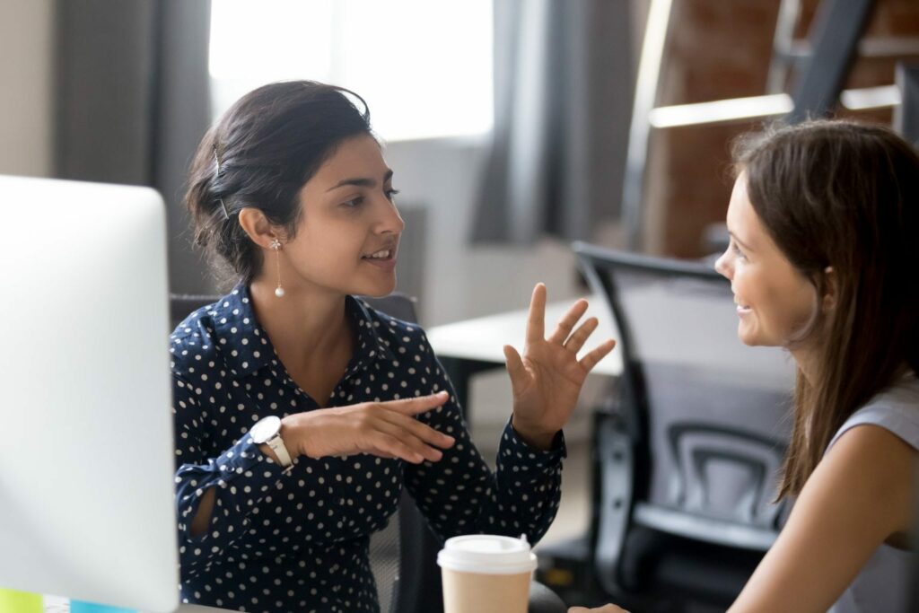 An HR expert talking to an employee