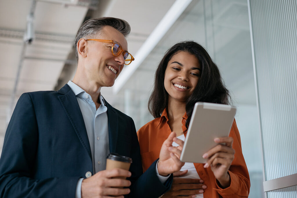 Two people at work talking