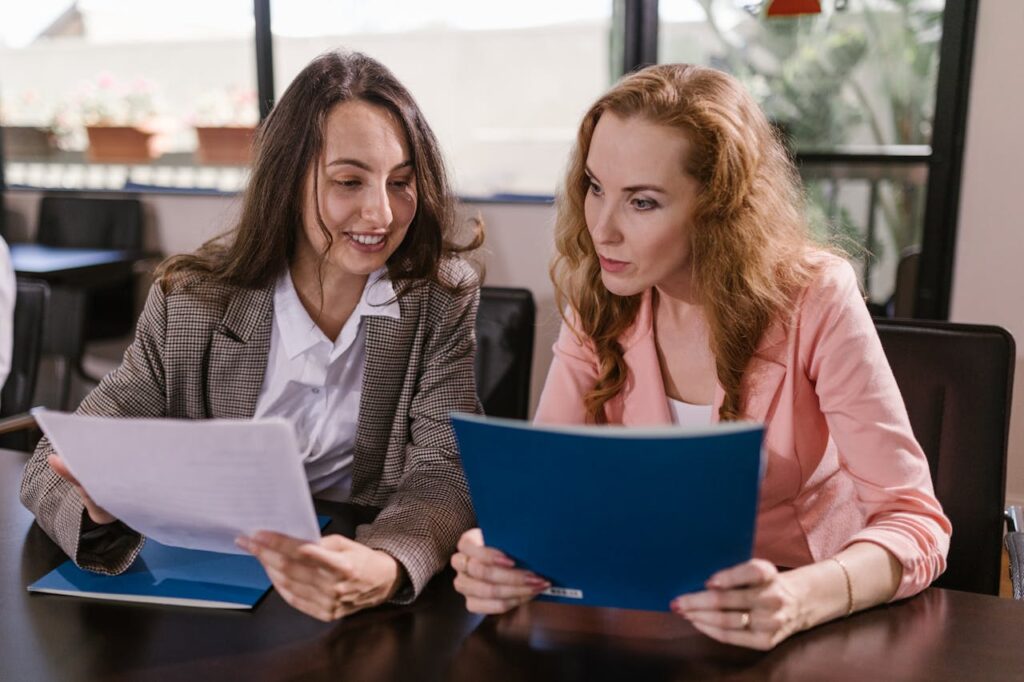 Two women reviewing documents