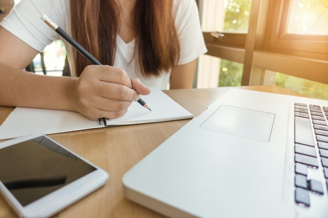 A person taking notes