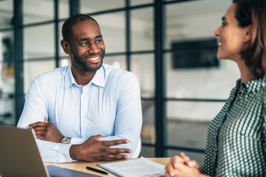 A man and woman in a meeting